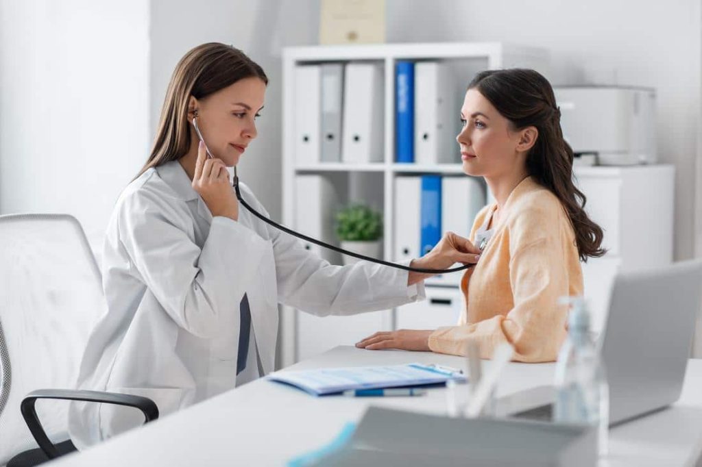 doctor listening to patient heart for signs of stress